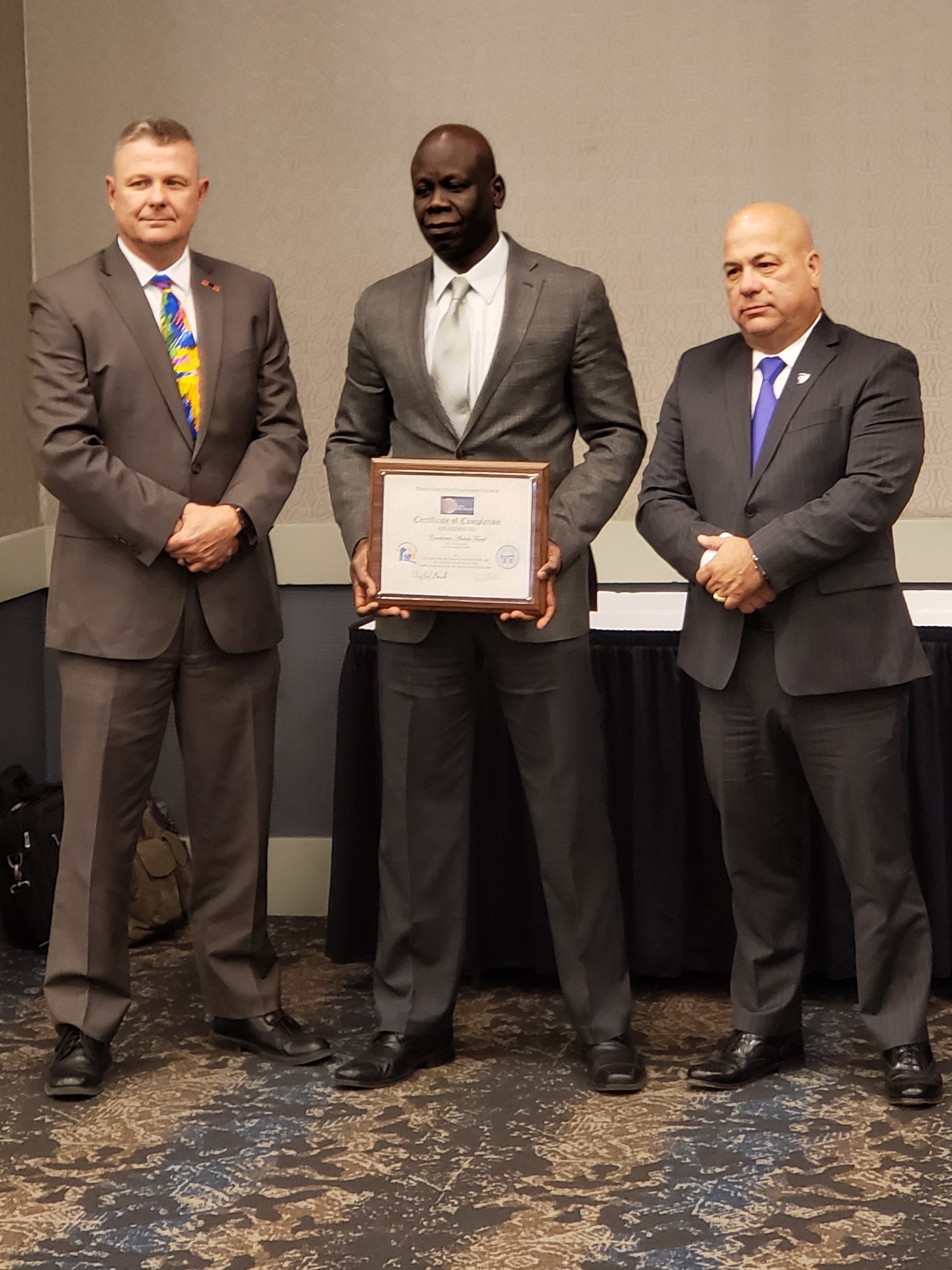 Picture of of Abdu getting certificate 