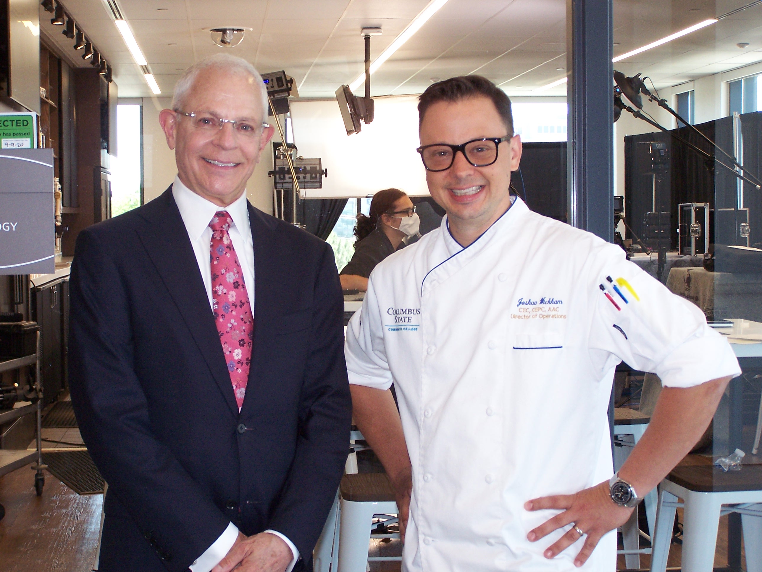 Robert , Nelson, left, with Josh Wickham, senior director of the School of Hospitality Management and Culinary Arts. 