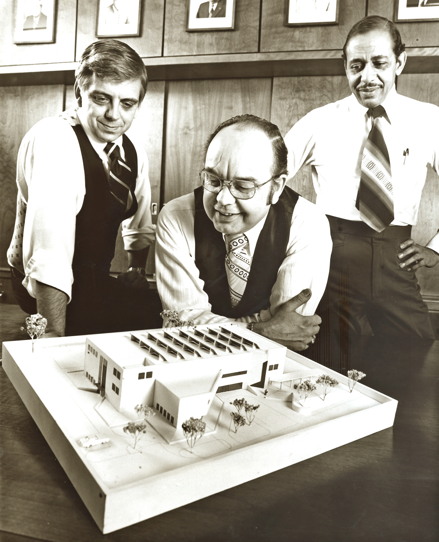 left to right: Michael Leymaster, President Harold Nestor, and Harold Brown, vice president of Academic Affairs, as they examined a model of Franklin Hall before its construction.