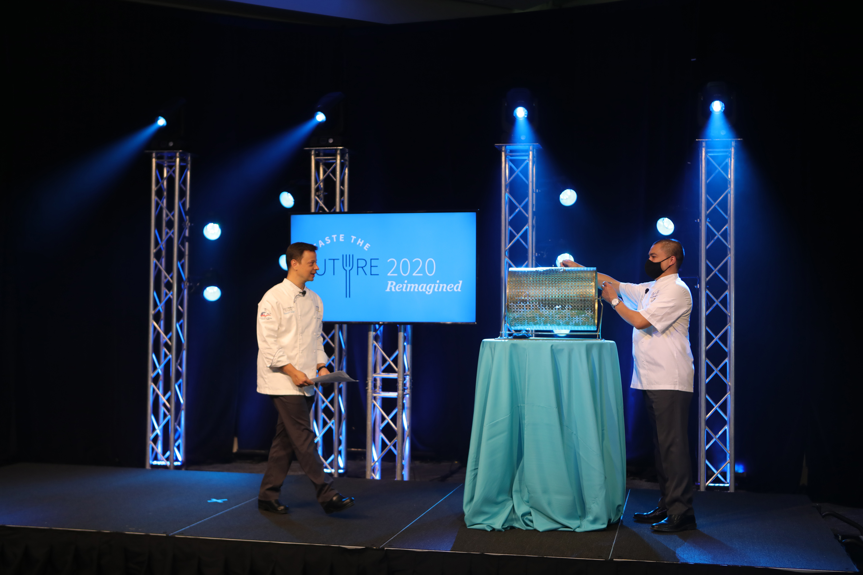 A picture of two chefs on stage during the live portion of Taste the Future.