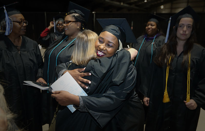 photo of graduates hugging