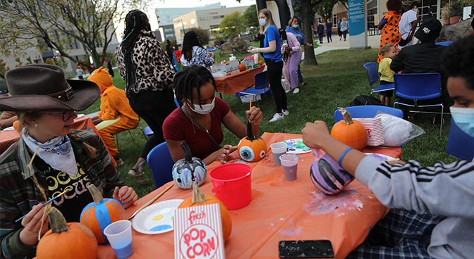 
Students painting pumpkins before the movie.
