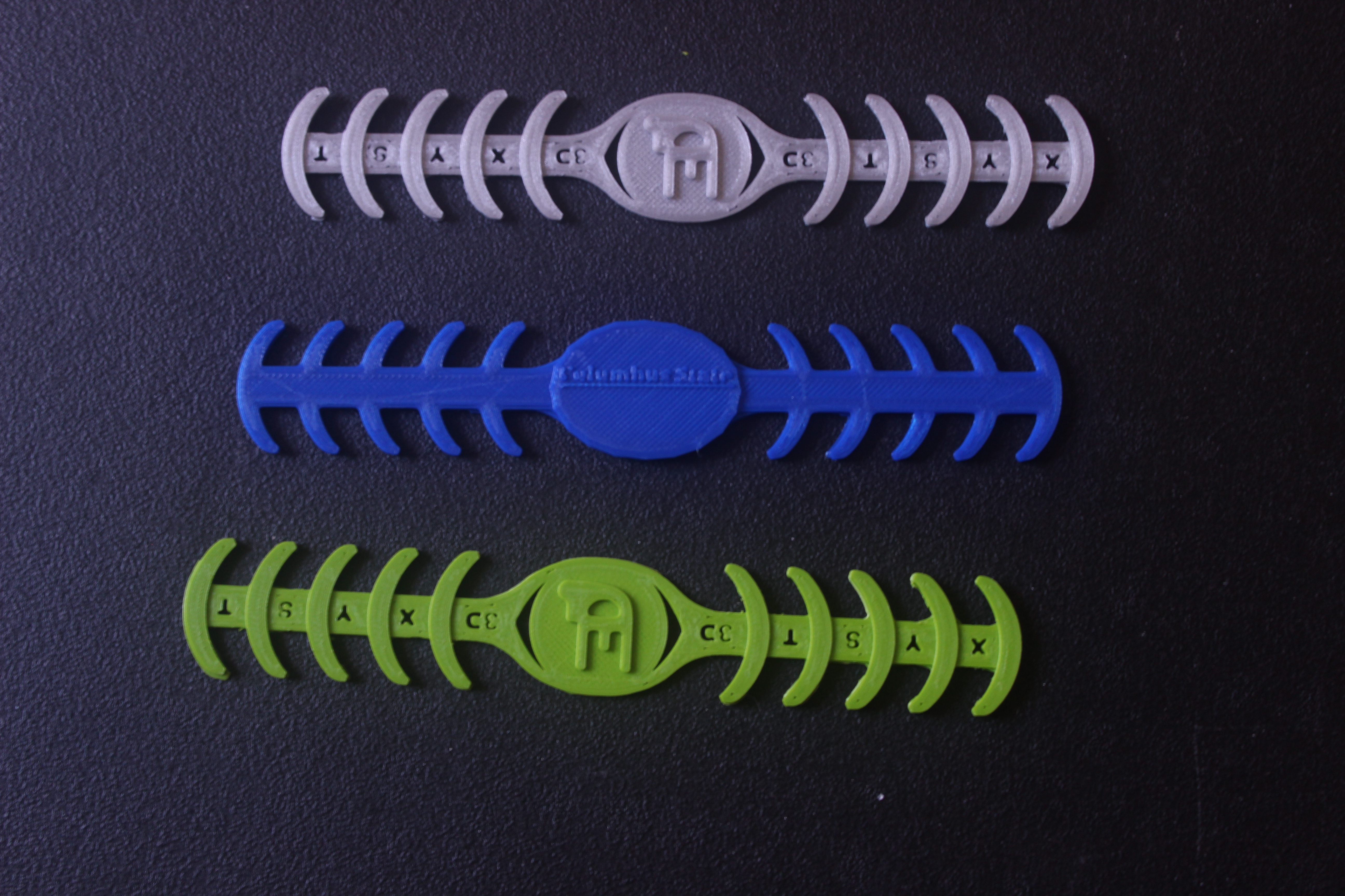 A picture of three face-mask buckles