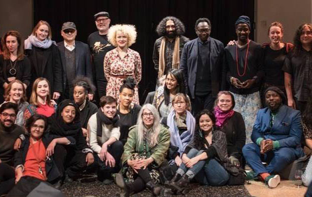 , Rocco Di Pietro, third from left in the back row with a ball cap, is pictured after his performance in Berlin in 2018. He had performed his musical work, "Message From Julius Eastman," which he has also performed on the Columbus Campus. 